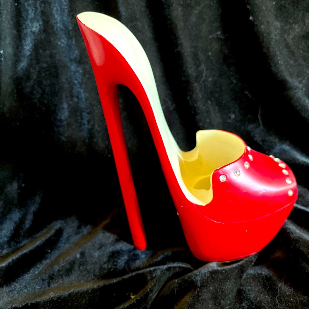 Cell phone holder.  Sexy bright red with sparkles. 7” spike heel.  Hands free